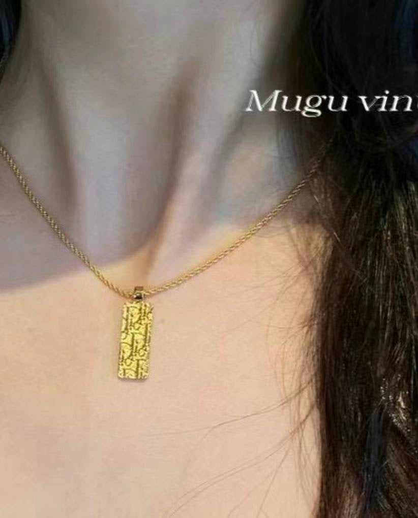 Dior gold monogram print double sided necklace