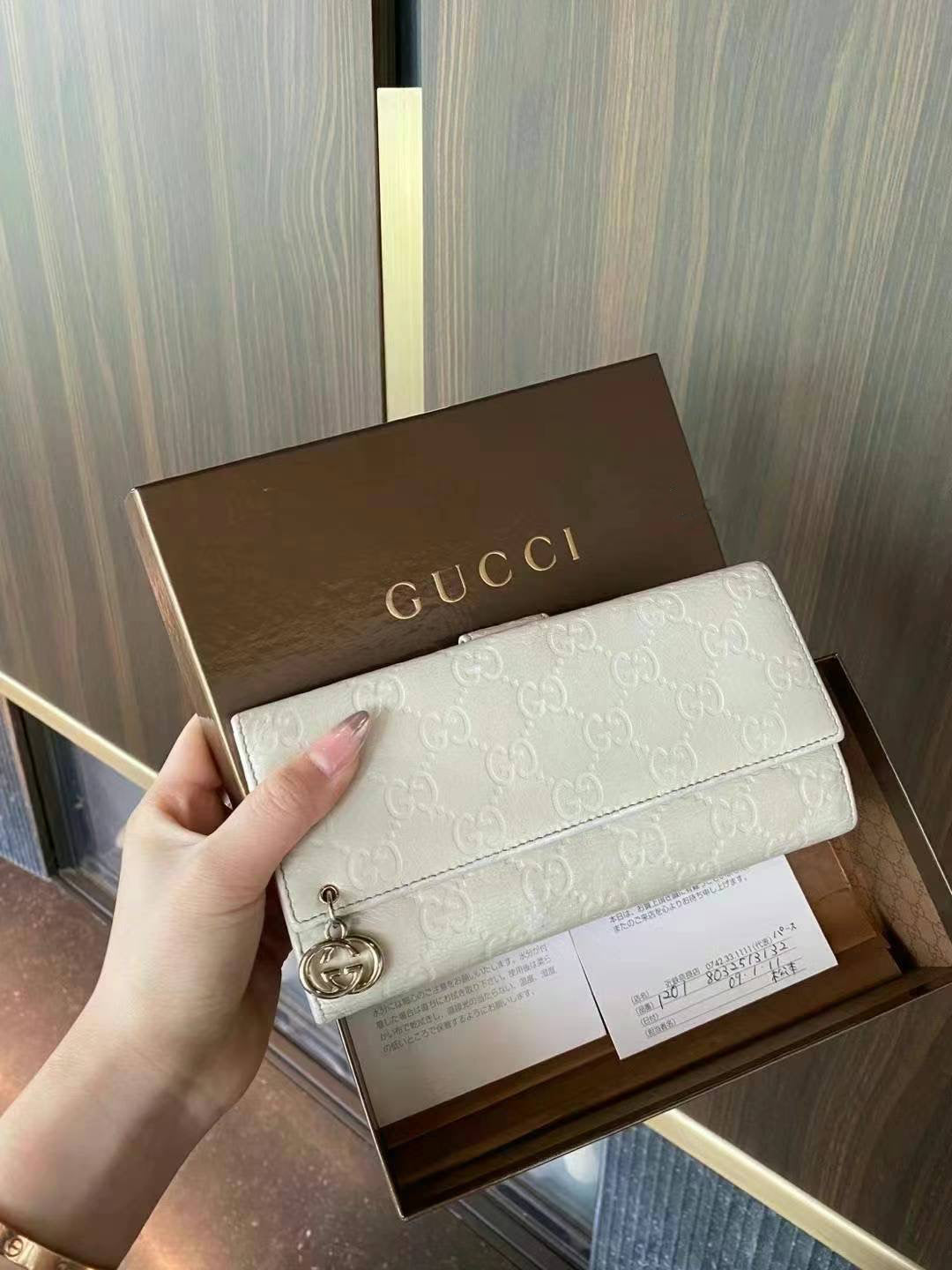 Gucci Guccisimi wallet in white / gold